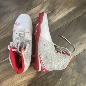 Under Armour, ladies lacrosse cleats, size 8, red and white gently used.
